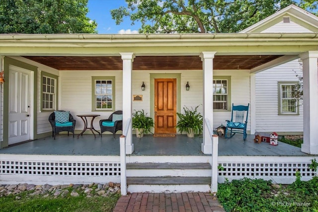 entrance to property with covered porch