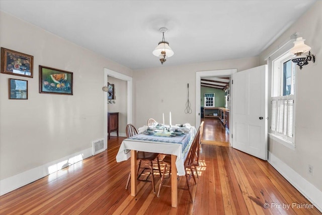 dining room featuring wood-type flooring