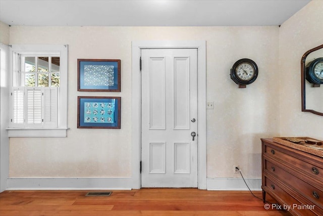 foyer with light hardwood / wood-style flooring