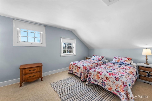 bedroom featuring light colored carpet and lofted ceiling