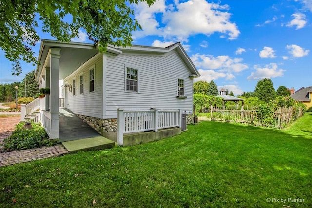 view of side of home featuring a lawn