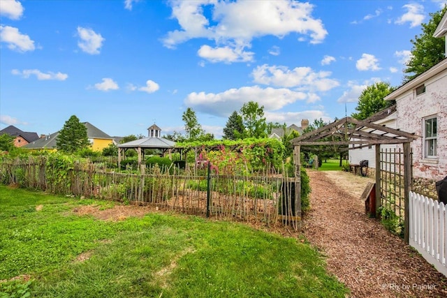 view of yard featuring a gazebo and a pergola