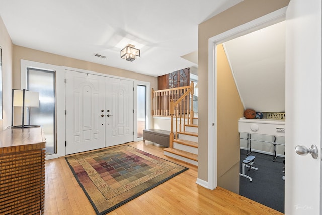 entryway with a healthy amount of sunlight and wood-type flooring