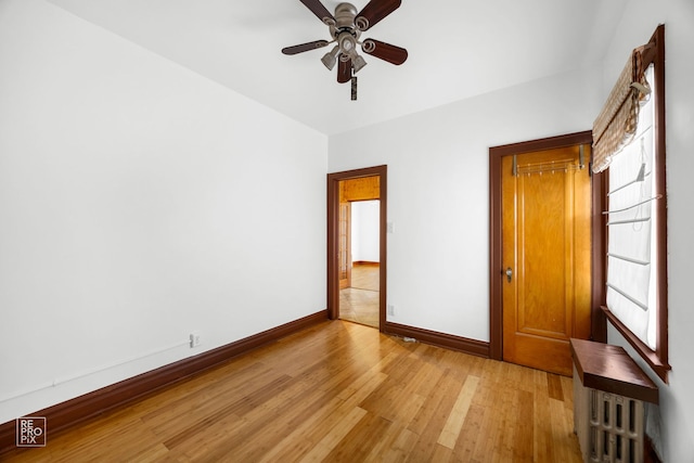 unfurnished bedroom featuring light hardwood / wood-style flooring and ceiling fan