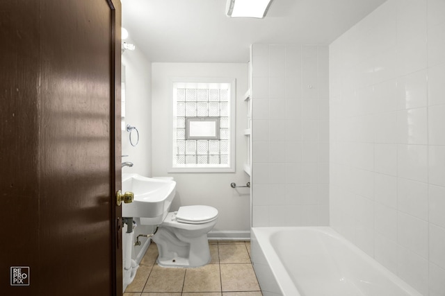 bathroom with tile patterned floors and toilet