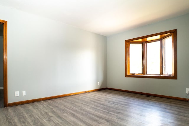 spare room featuring hardwood / wood-style flooring