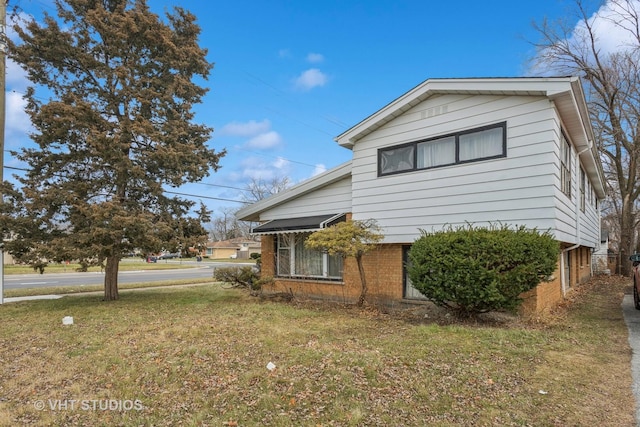 view of property exterior with a yard