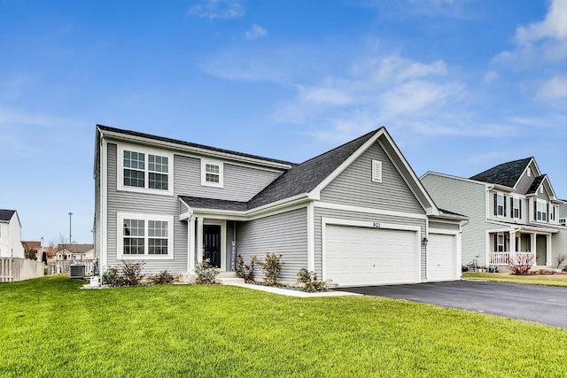 view of property with central air condition unit, a front yard, and a garage