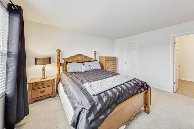 bedroom with light carpet