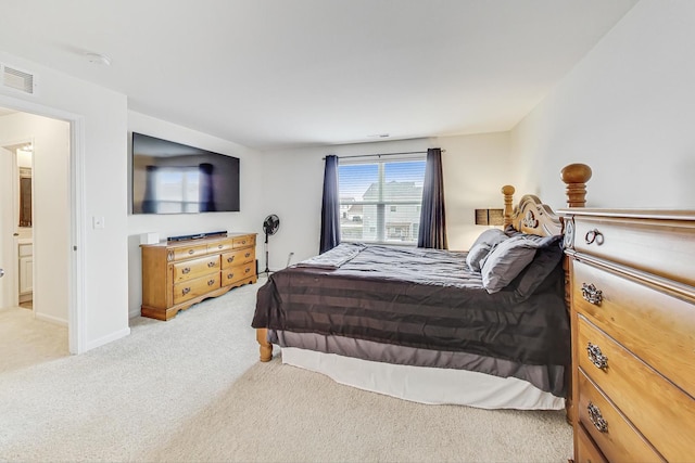 carpeted bedroom with ensuite bathroom