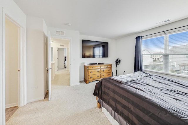 bedroom with light carpet