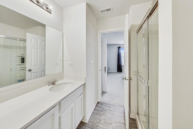 bathroom featuring vanity and walk in shower