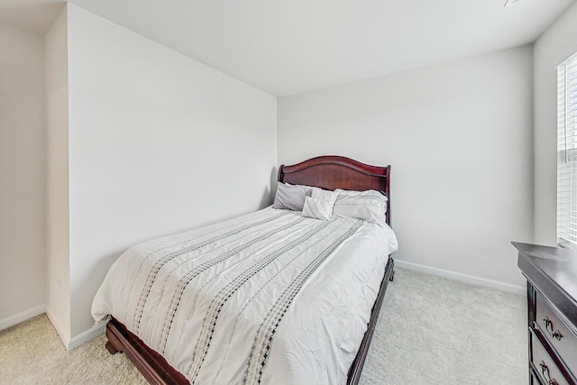 bedroom with light colored carpet