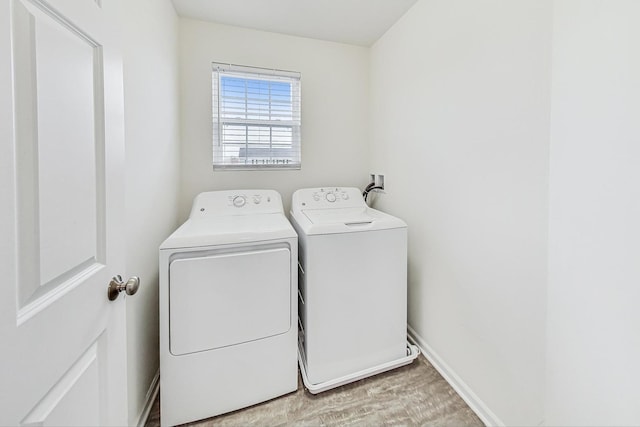 laundry area featuring washing machine and clothes dryer