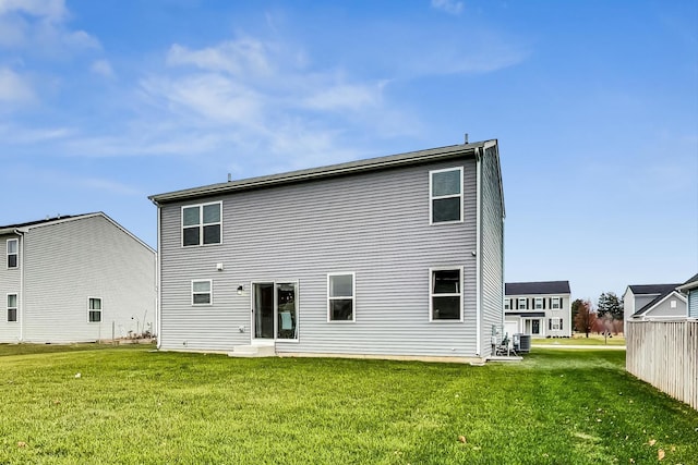 rear view of house with a lawn