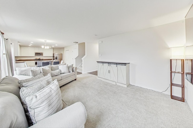 living room with a chandelier and light colored carpet