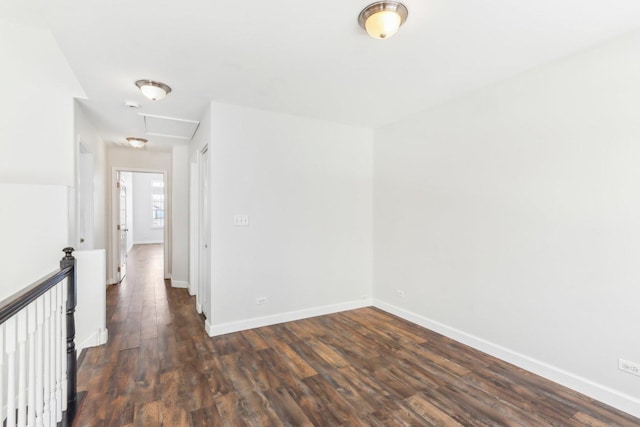 spare room with dark hardwood / wood-style floors