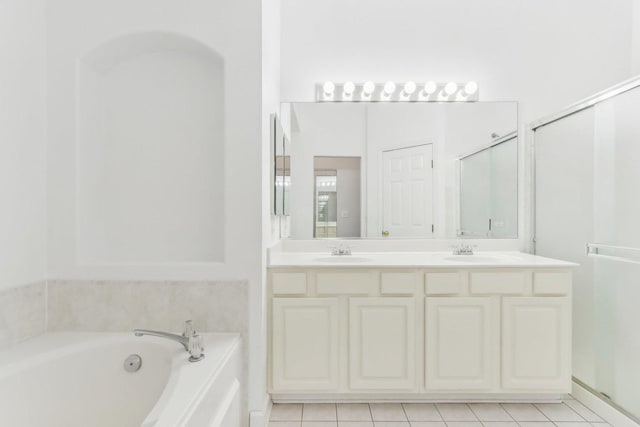 bathroom with vanity, plus walk in shower, and tile patterned floors