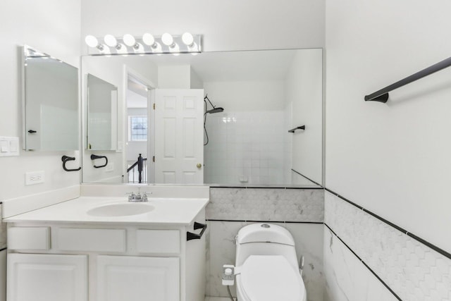 bathroom with toilet, walk in shower, and vanity