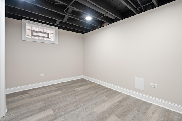 basement featuring hardwood / wood-style floors