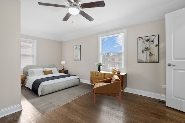 bedroom featuring dark hardwood / wood-style flooring and ceiling fan