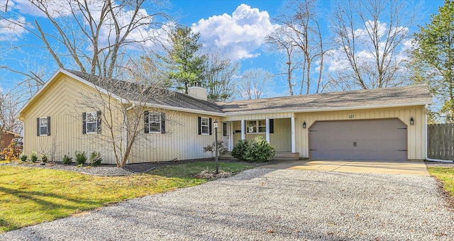 single story home with a front lawn and a garage