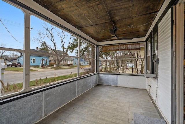 unfurnished sunroom featuring plenty of natural light