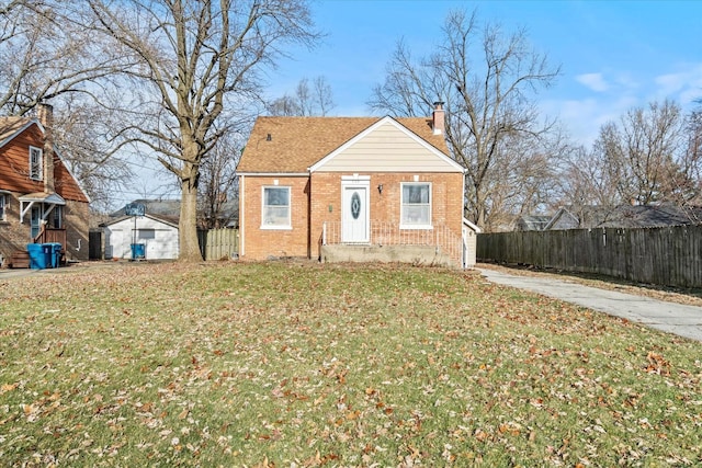 bungalow-style home featuring a front yard