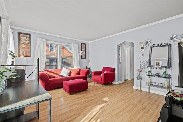 living room featuring hardwood / wood-style floors and crown molding