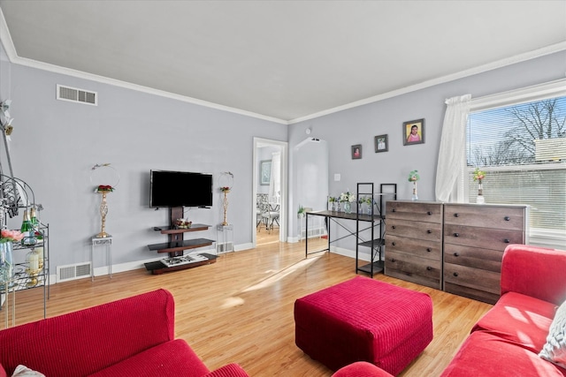 living room featuring crown molding and wood-type flooring