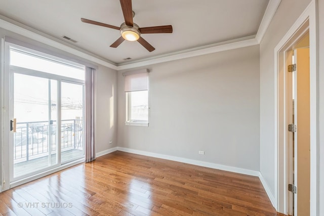 unfurnished room featuring wood-type flooring, ceiling fan, and ornamental molding