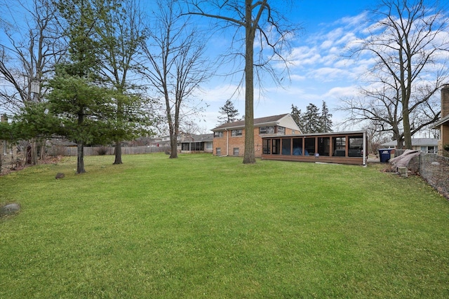 view of yard with a sunroom