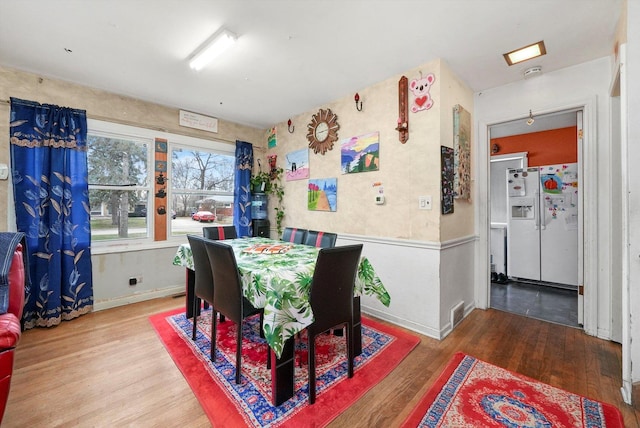 dining room with hardwood / wood-style floors