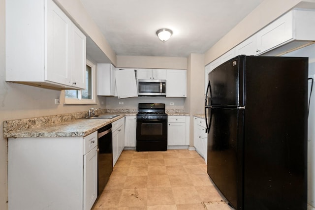 kitchen featuring white cabinetry, sink, and black appliances