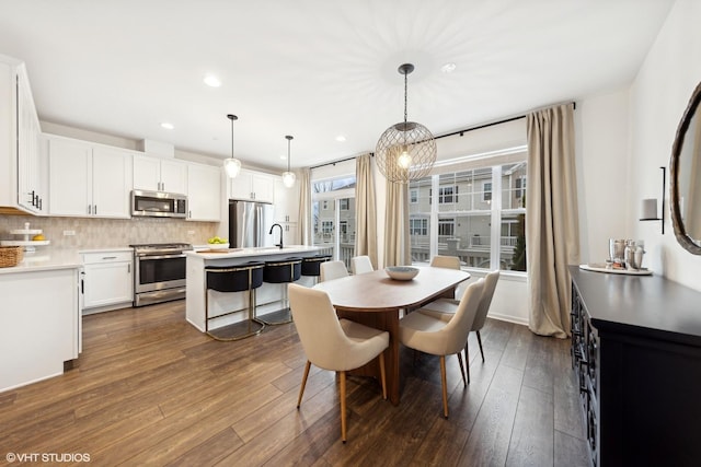 dining space featuring dark hardwood / wood-style floors