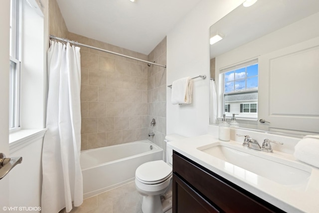 full bathroom featuring tile patterned floors, vanity, shower / bath combo, and toilet