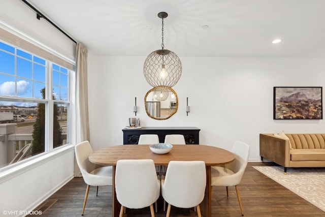 dining area with dark hardwood / wood-style floors