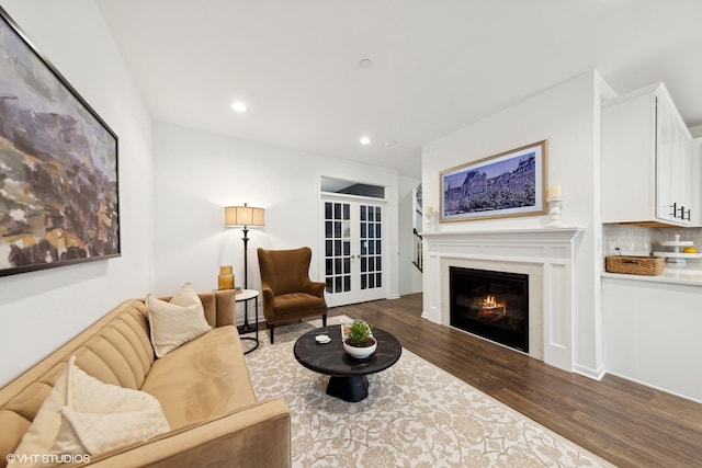 living room with french doors and dark hardwood / wood-style flooring