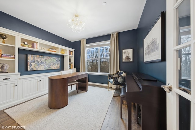 office featuring a chandelier and hardwood / wood-style flooring