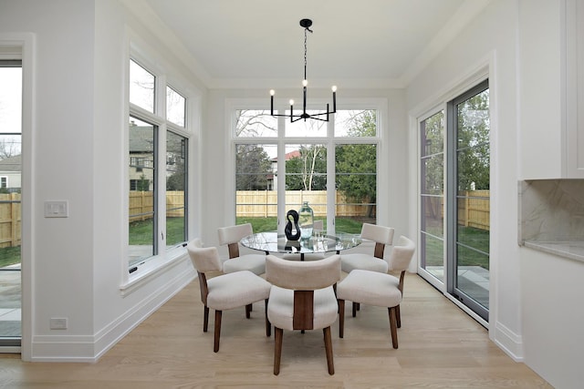 sunroom with an inviting chandelier