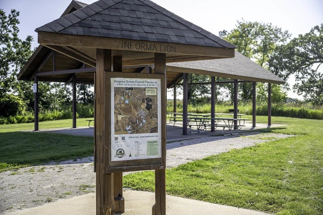 surrounding community with a gazebo and a lawn