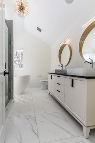 full bathroom with a chandelier, lofted ceiling, toilet, vanity, and independent shower and bath