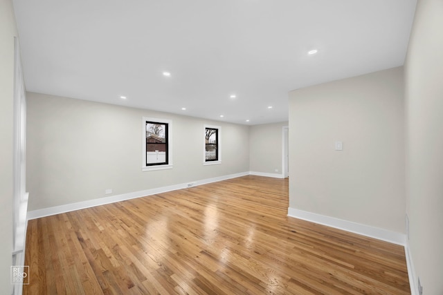 empty room with light hardwood / wood-style floors