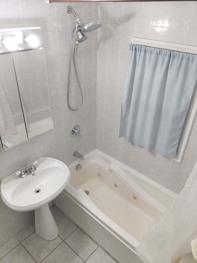 3231 N Schultz Dr, Lansing, IL 60438 - full bathroom featuring tile patterned flooring, a combined bath / shower with jetted tub, a sink, and tile walls