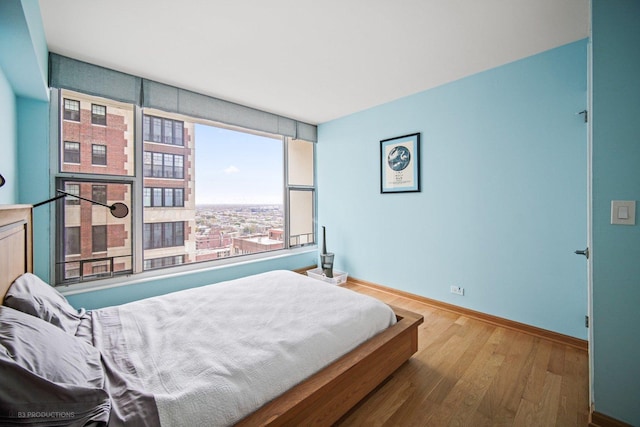 bedroom featuring wood-type flooring