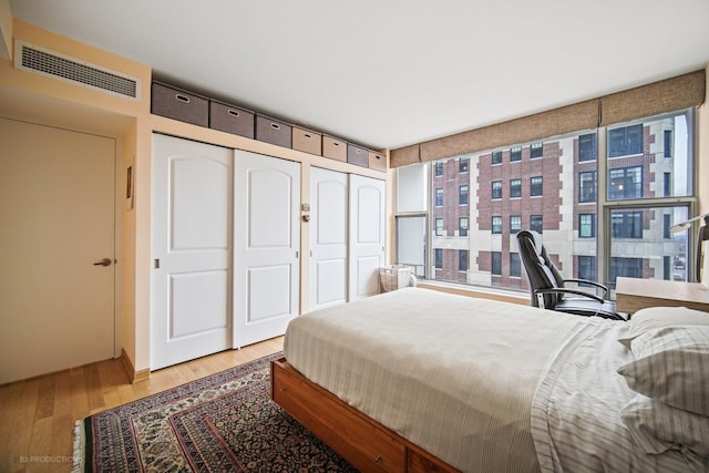 bedroom with a closet and light wood-type flooring