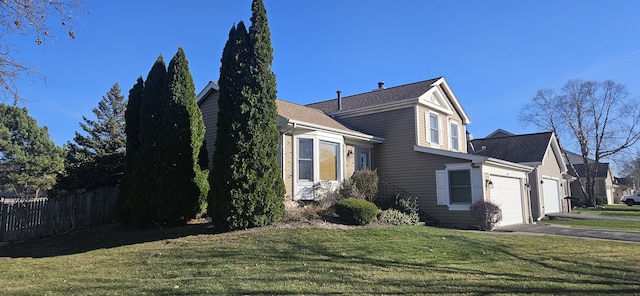 view of property exterior featuring a yard and a garage