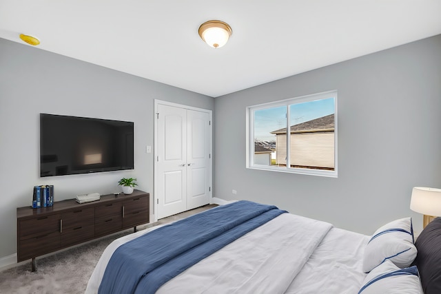 carpeted bedroom with a closet