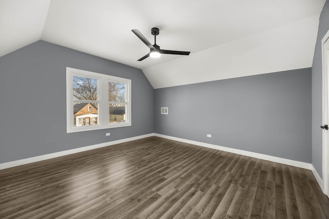 bonus room featuring dark hardwood / wood-style flooring, vaulted ceiling, and ceiling fan