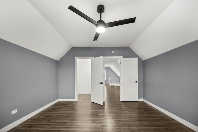 additional living space featuring dark hardwood / wood-style floors, ceiling fan, and lofted ceiling